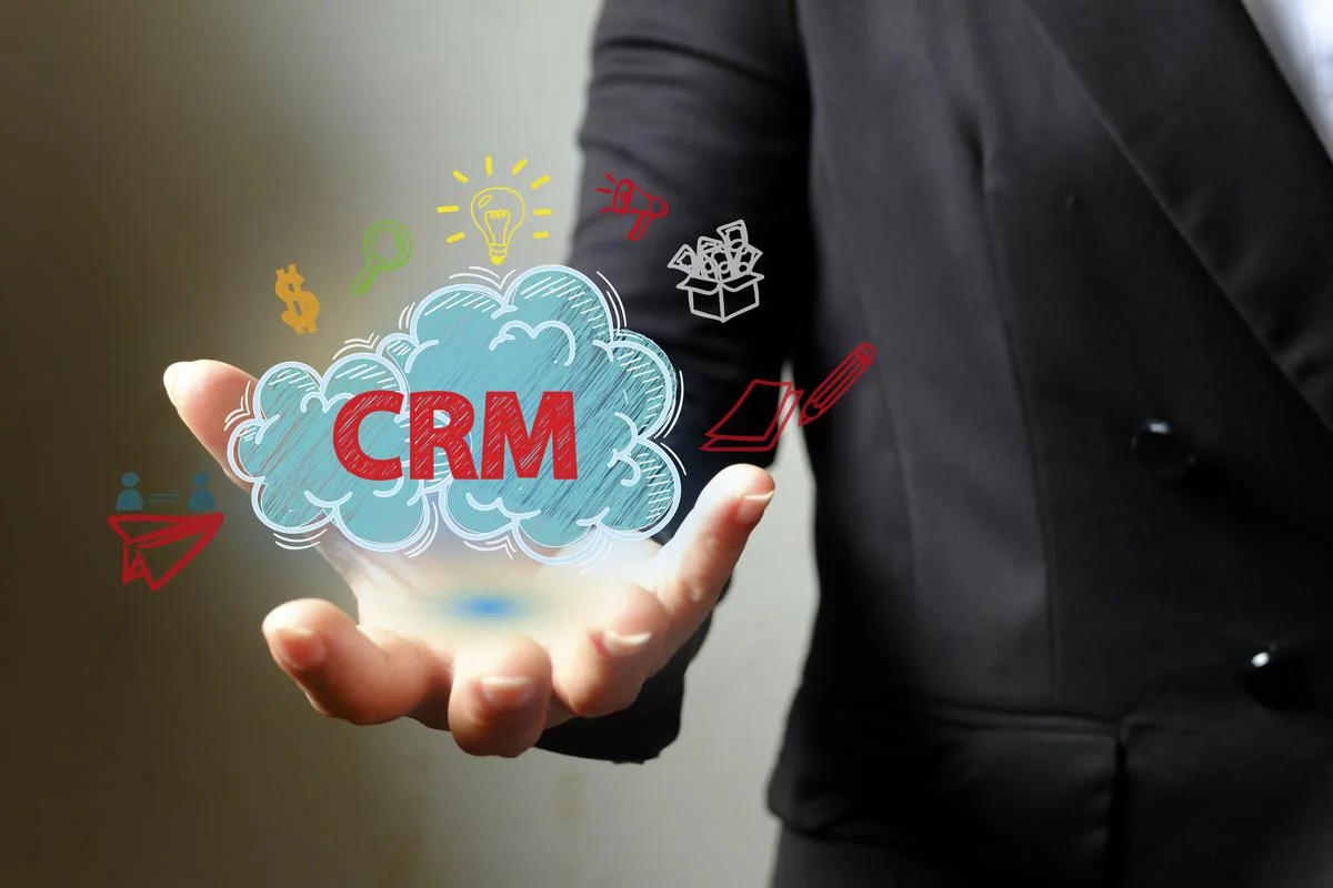 CRM-cloud-in-a-man's-hand-crm-management-techniques-and-crm-data-analysis